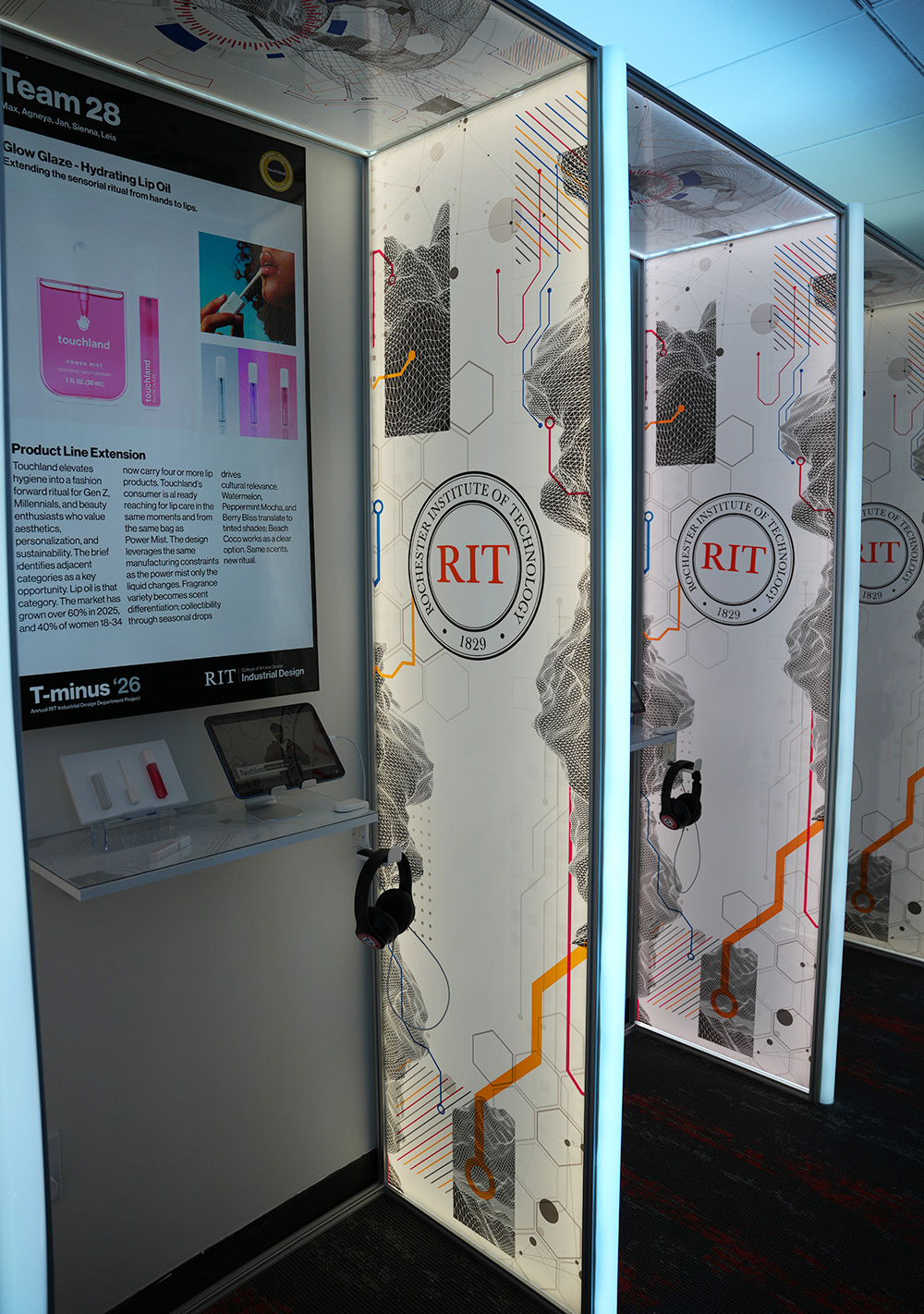 A digital display at Church & Dwight highlighting projects students made in collaboration with the company.
