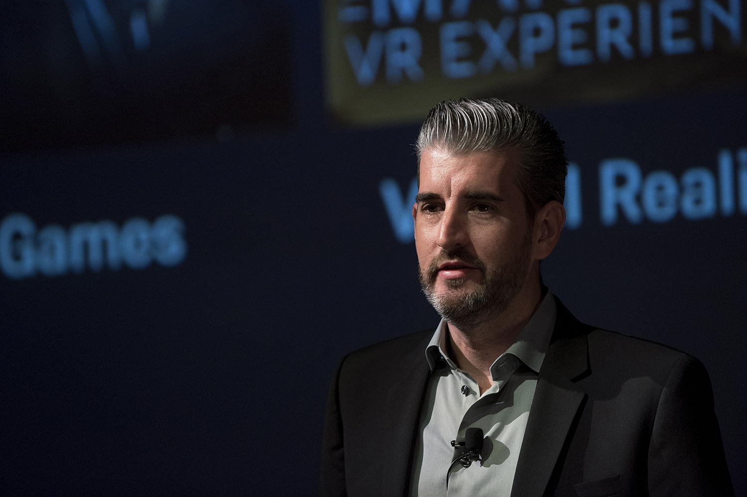 Shot of man talking on stage