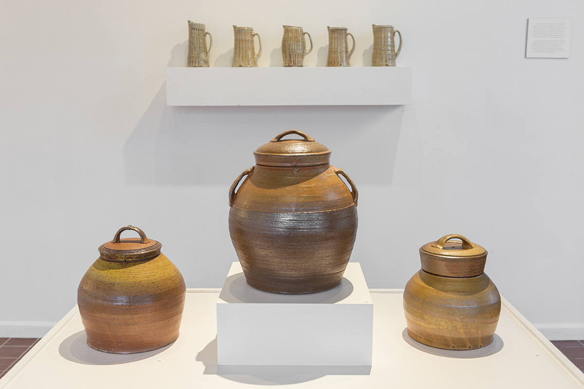 A collection of brown ceramic vessels.