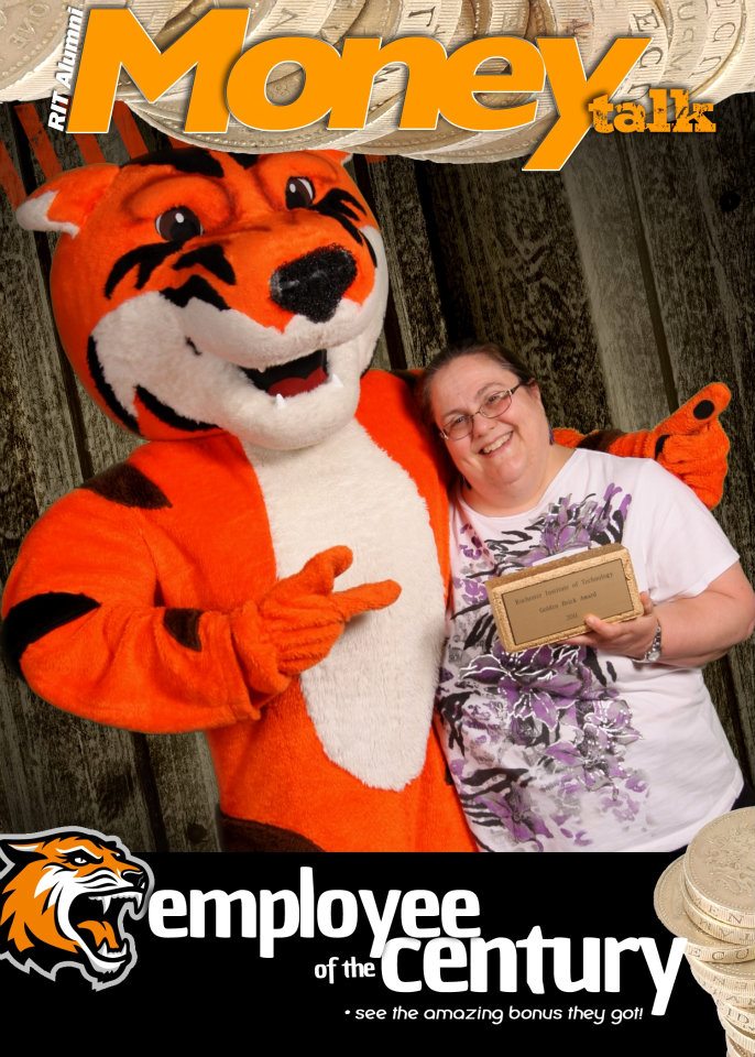 Deb Kingsbury and Ritchie the Tiger holding golden brick award