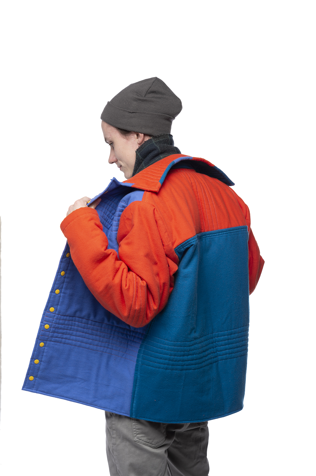 A design of a vibrant blue and orange winter coat.