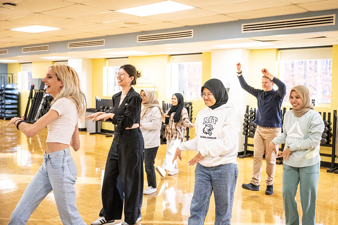 college students of varying ethnicities in a hip hop dance class.