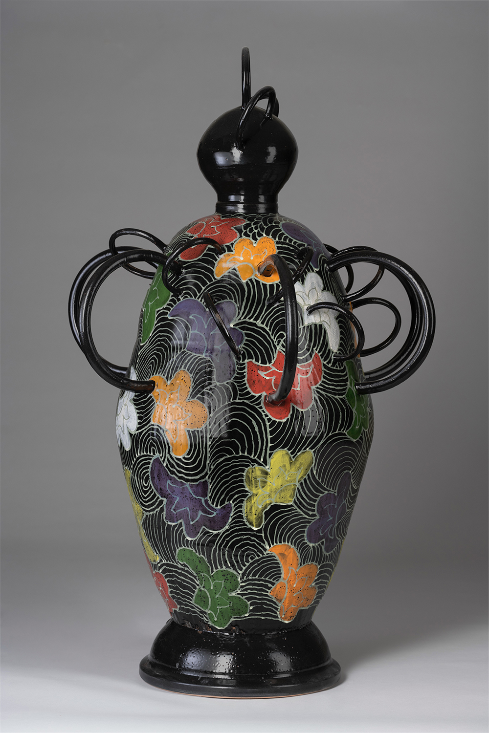 A ceramic sculpture with African-inspired motifs.
