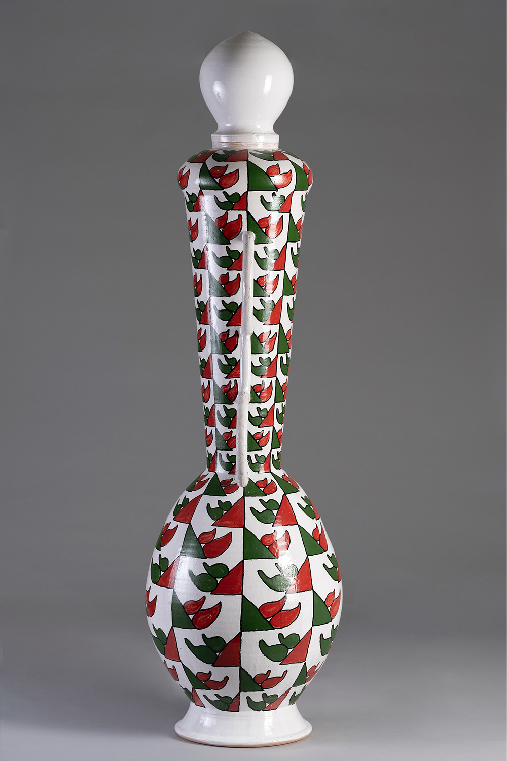 A ceramic sculpture with African-inspired motifs.