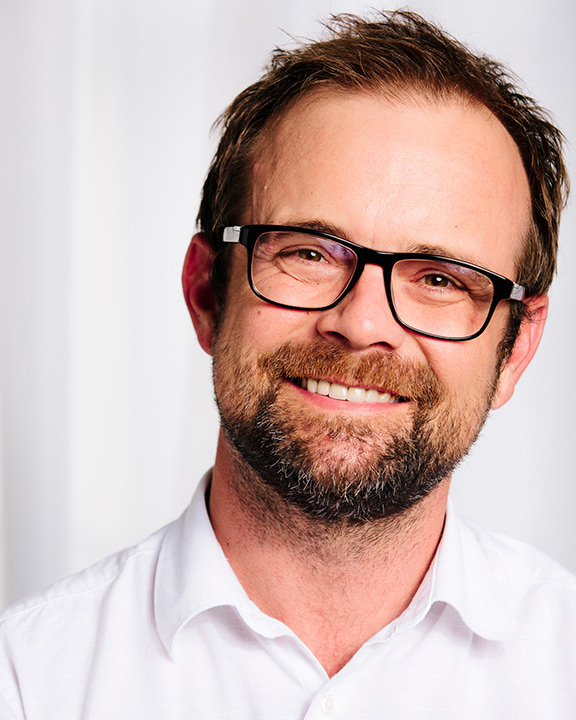 Head-and-shoulders view of man with glasses and beard