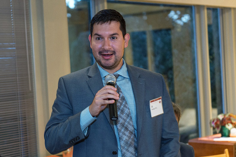 Man speaks with microphone.