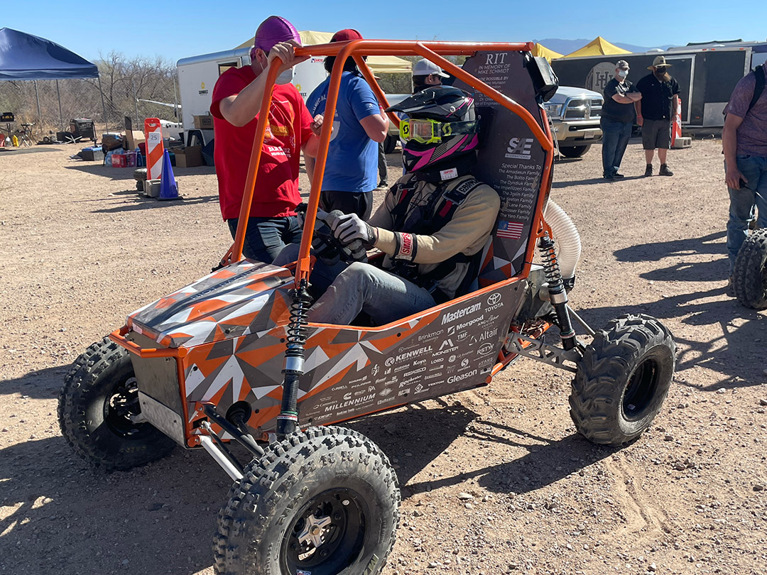 driver sitting in baja car.