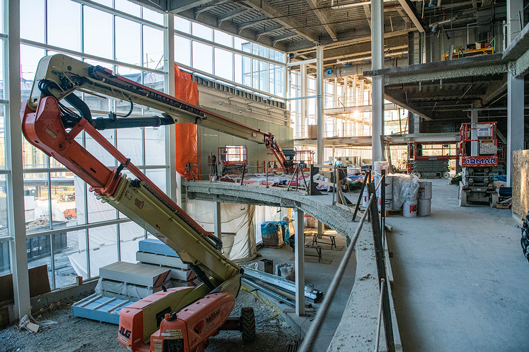 a construction crane inside a building under construction.