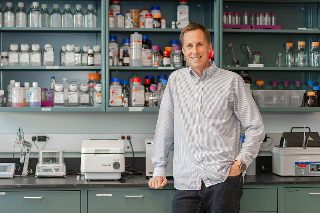 professor standing in a lab.