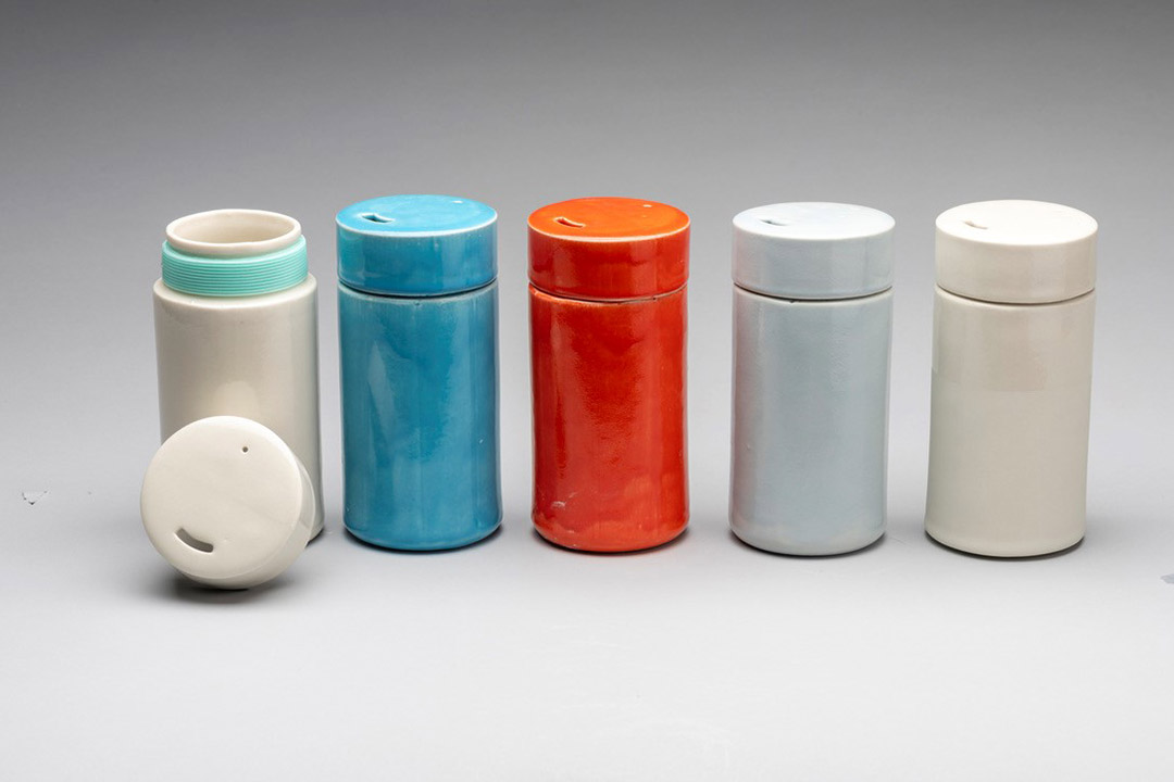 five ceramic travel mugs.