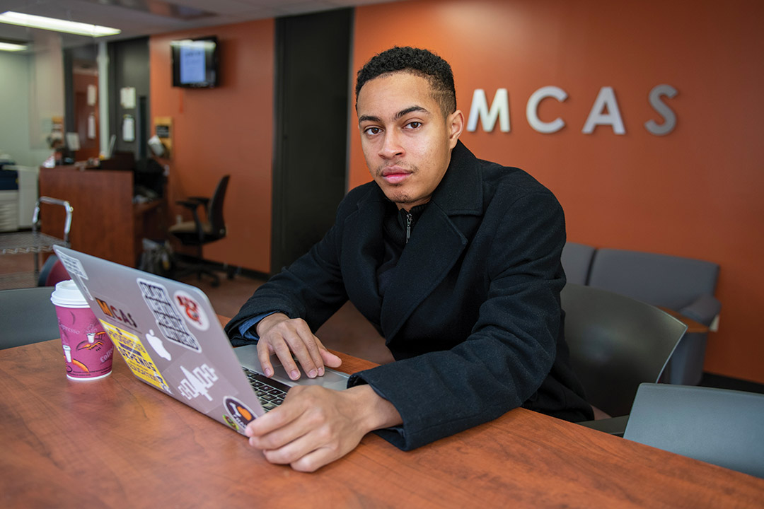 student working on a laptop.