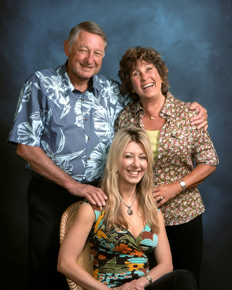 three people in a family photo.