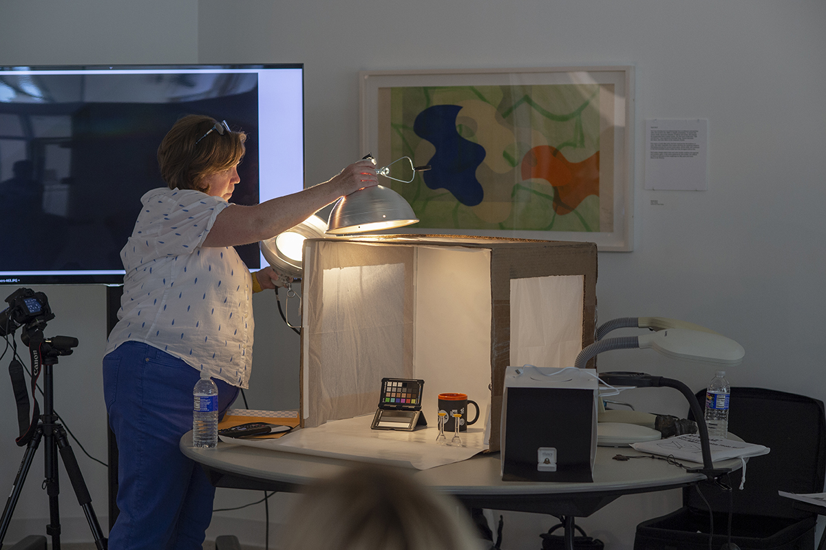 Nanette Salvaggio demonstrates how the cardboard lightbox is used.