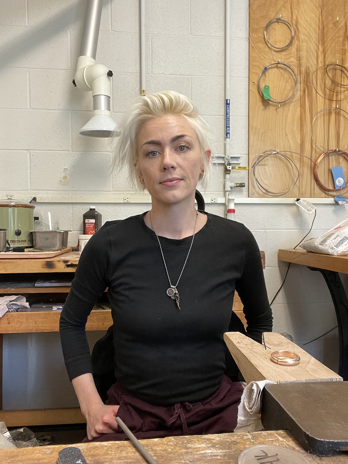 Laurel Fulton in a metalworking shop.