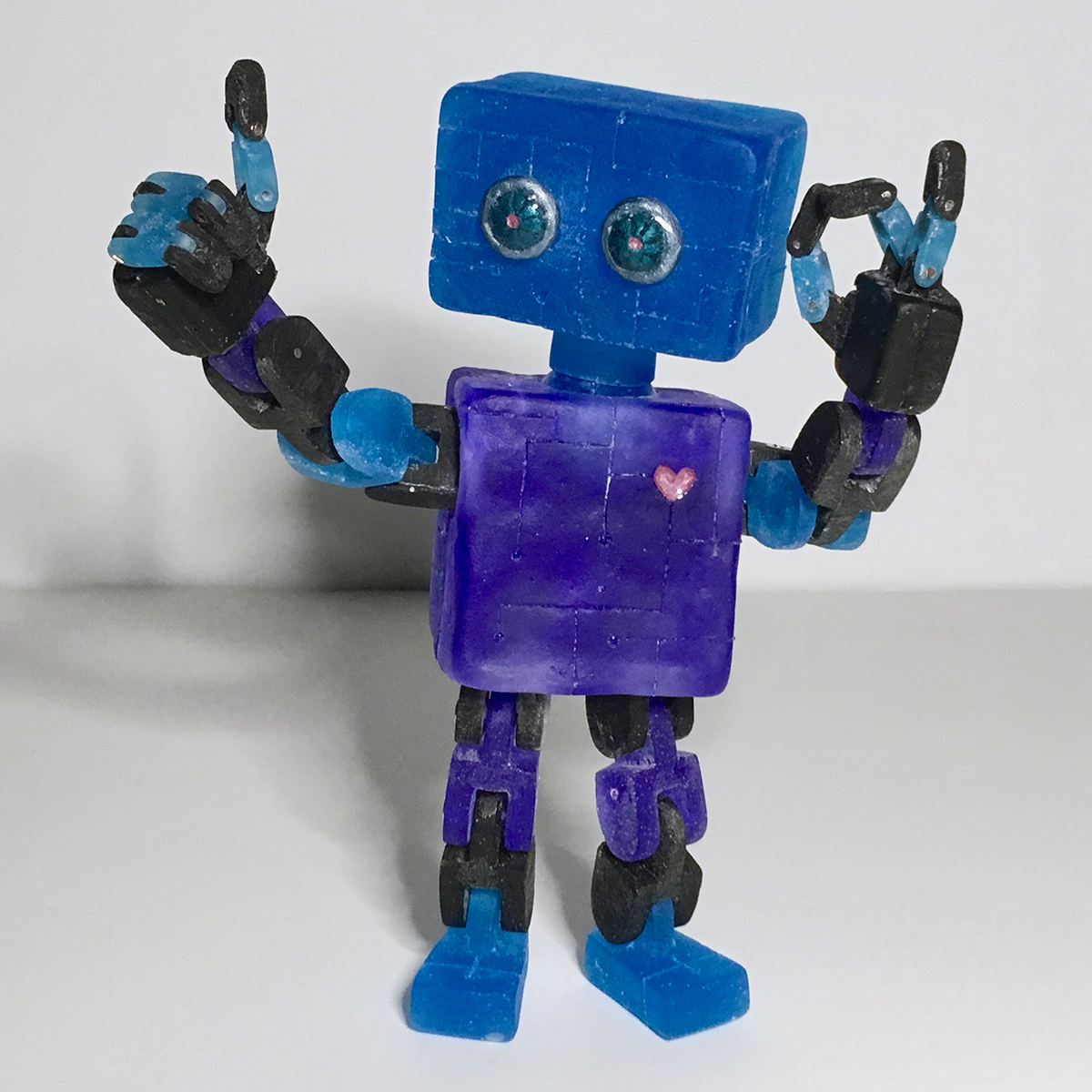 A small toy robot sculpture.