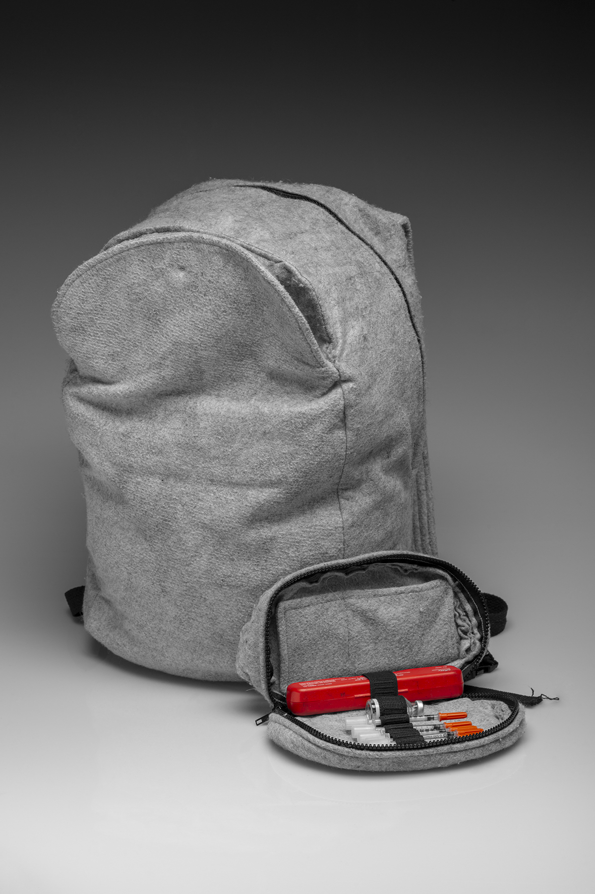 A backpack with a companion bag that holds smaller items. 