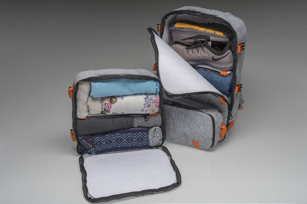Two bags designs -- one with neatly packed fabric items; the other holding clothing and footwear.