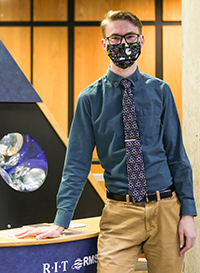 Keegan Kresge standing in the atrium at Gosnell Hall