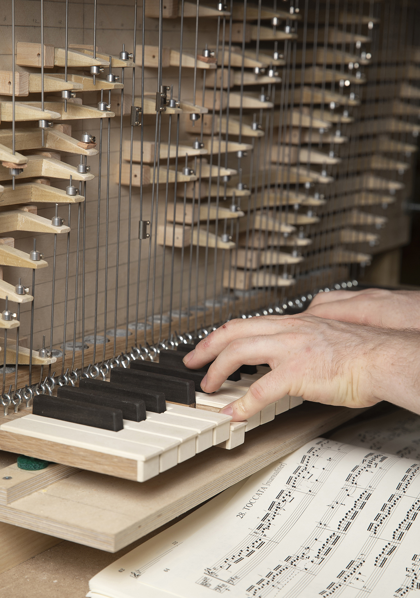 A detailed shot of Kelly Cleveland playing his pipe organ.
