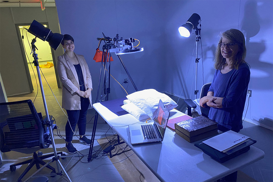 two researchers test imaging technique on a pillow.