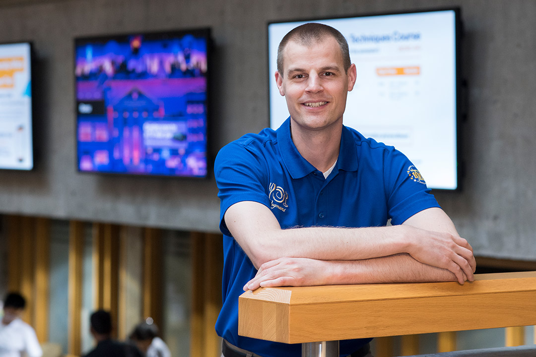 Bradley Weber stands in Lowenthal Hall.