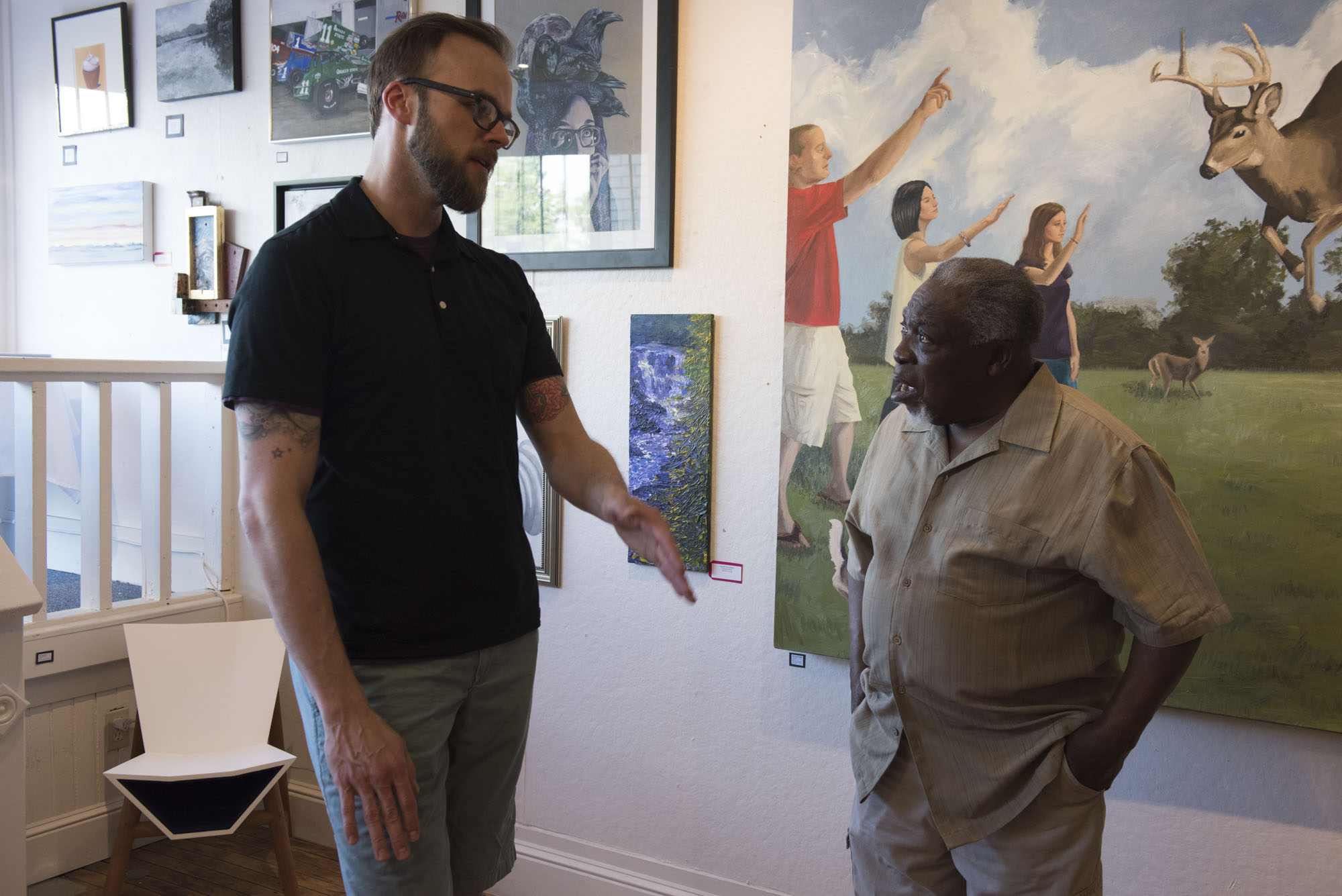 Todd Stahl and Luvon Sheppard chat in Joy Gallery.