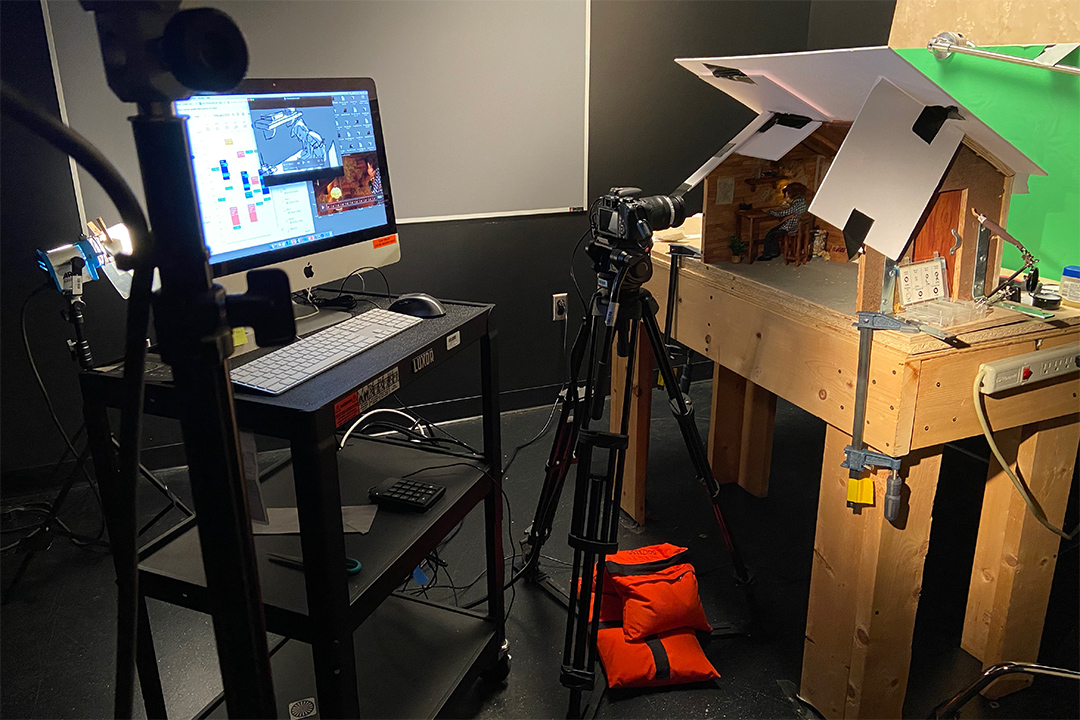 camera and computer recording a stop-motion film scene.