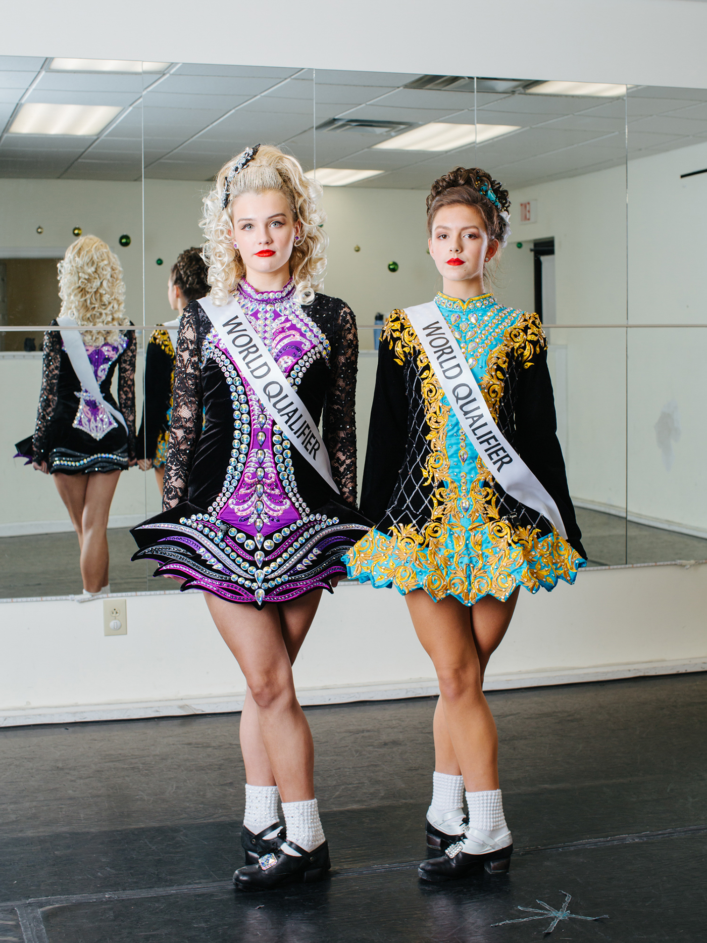 Portrait photography of two dancers standing side-by-side.