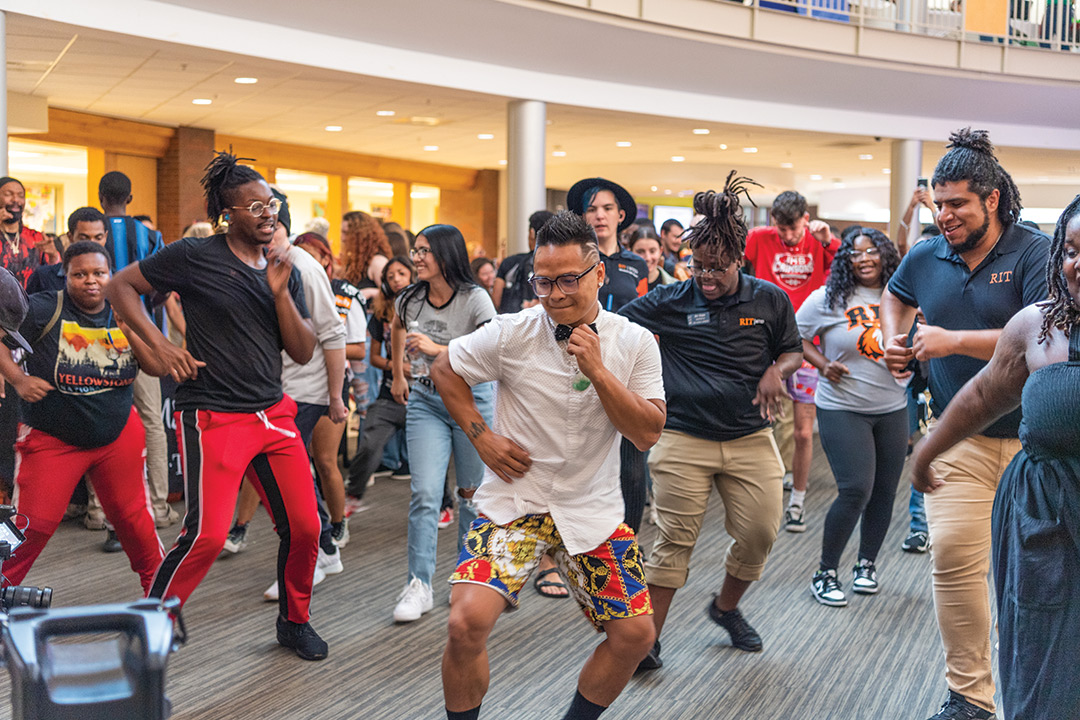 people dancing in a crowd.