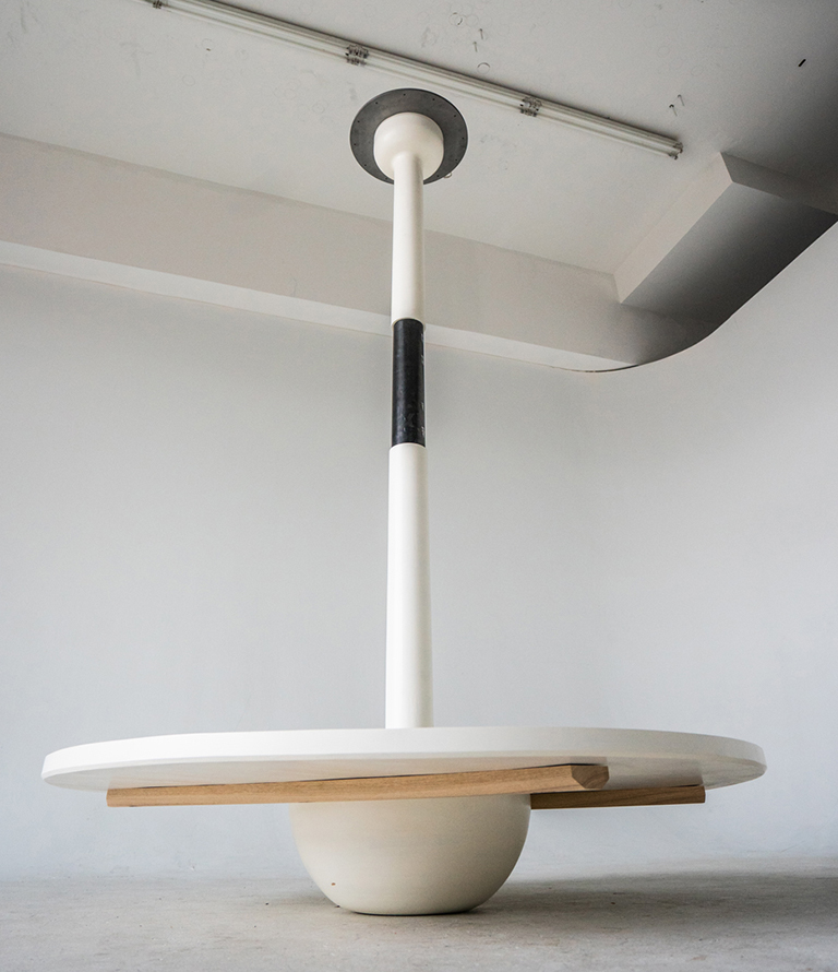 A hanging table that serves as functional art.