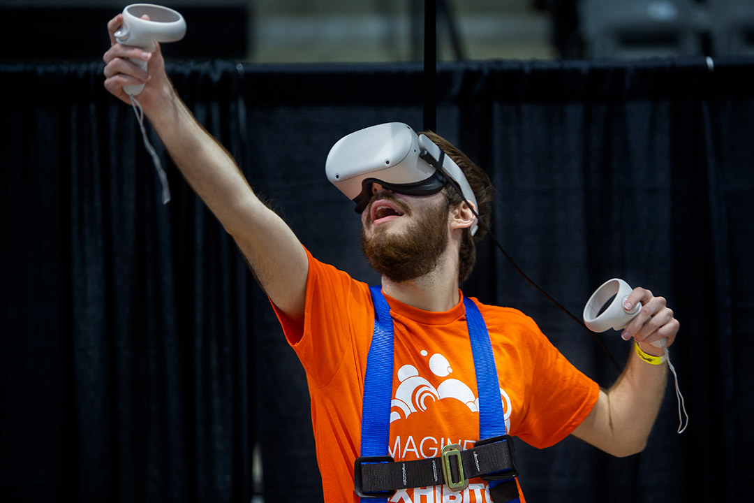 person using a virtual reality headset and handhelds.