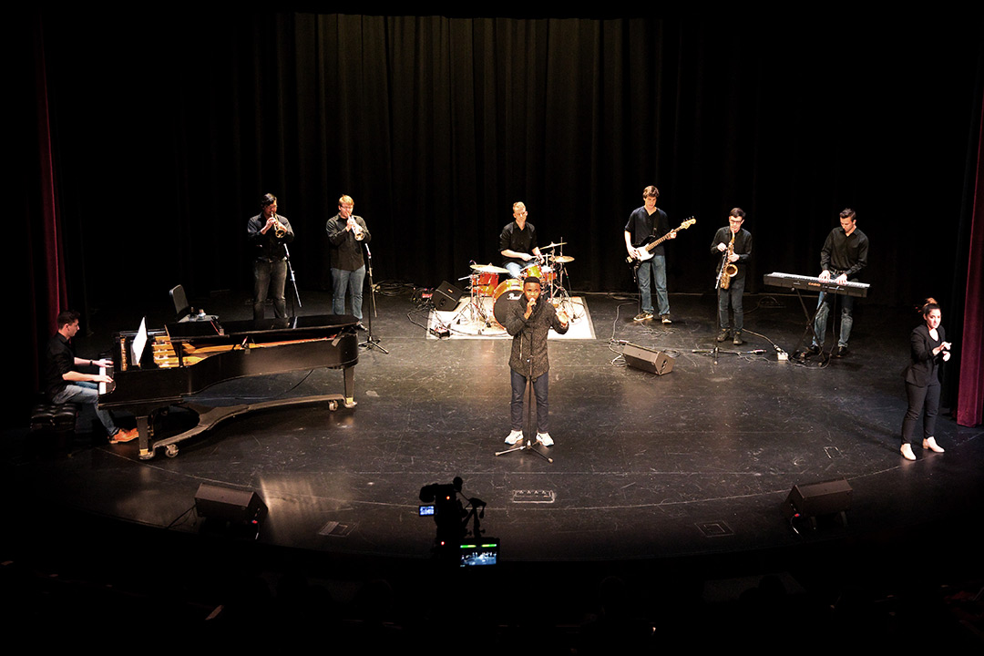 Band performs on stage.