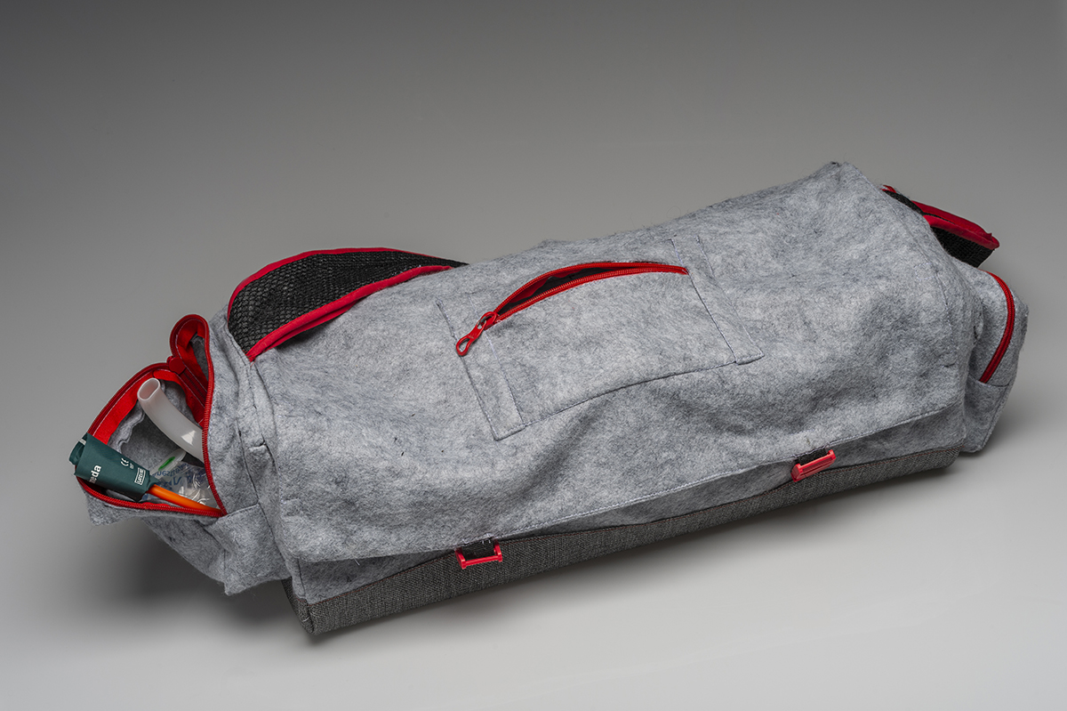 A long bag design colored grey and red.