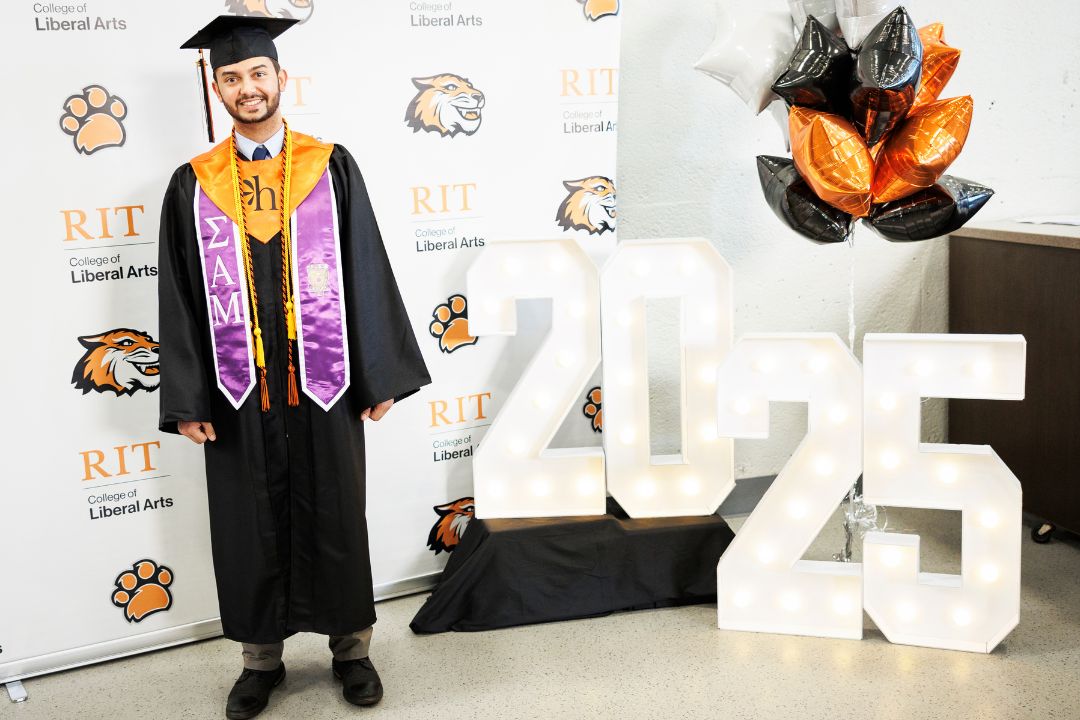 Afnaan poses for a portrait during pre-commencement festivitis