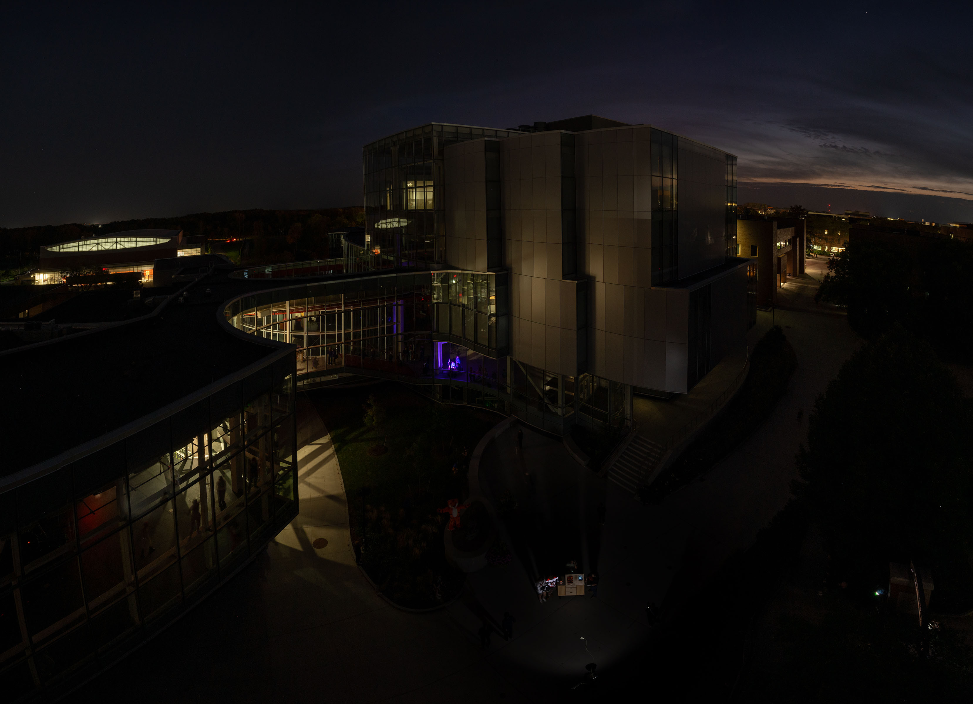 An aerial shot of the Student Hall for Exploration and Development shown in the dark with no surrounding lighting