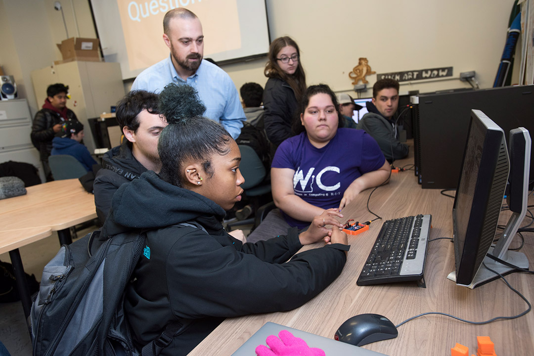 Group of students working on computer.