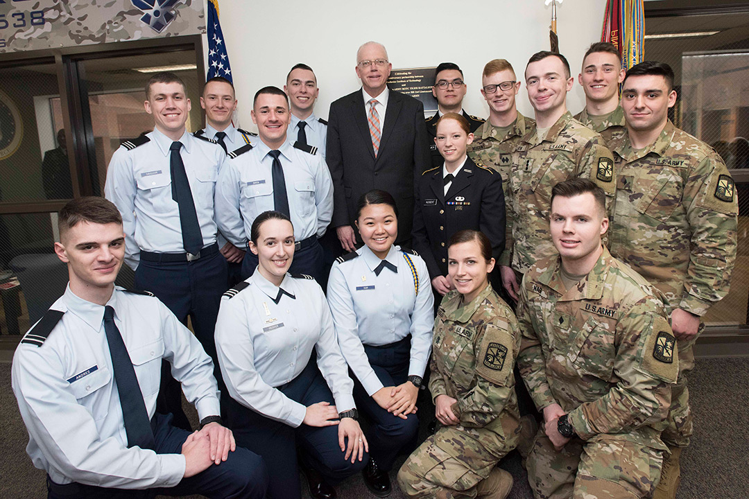 Group of Air Force and Army ROTC cadets pose in uniform