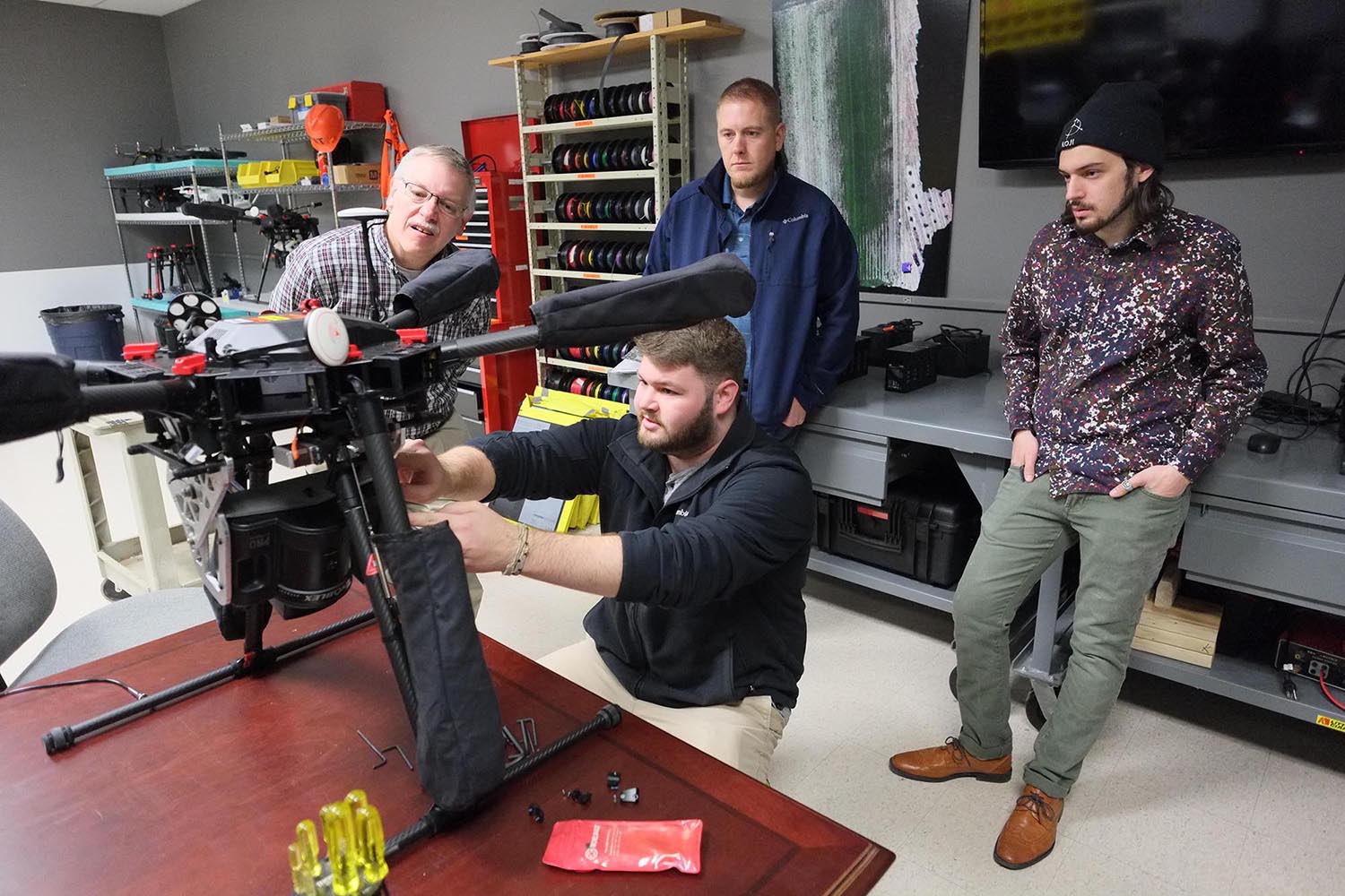 A group works on a drone