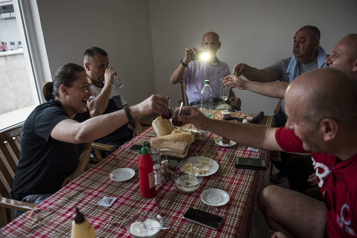 A group of people gathers around the dinner table