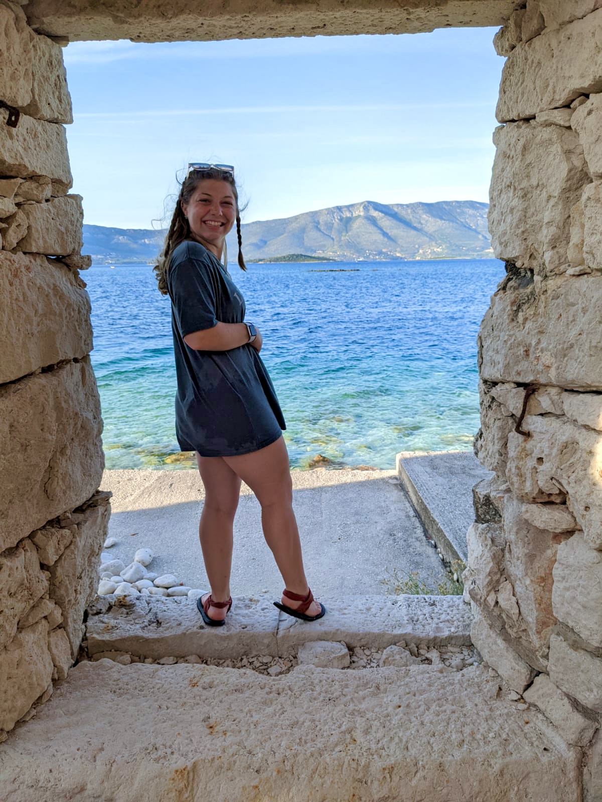 Bari Hayden in Croatia, with the sea in the background.