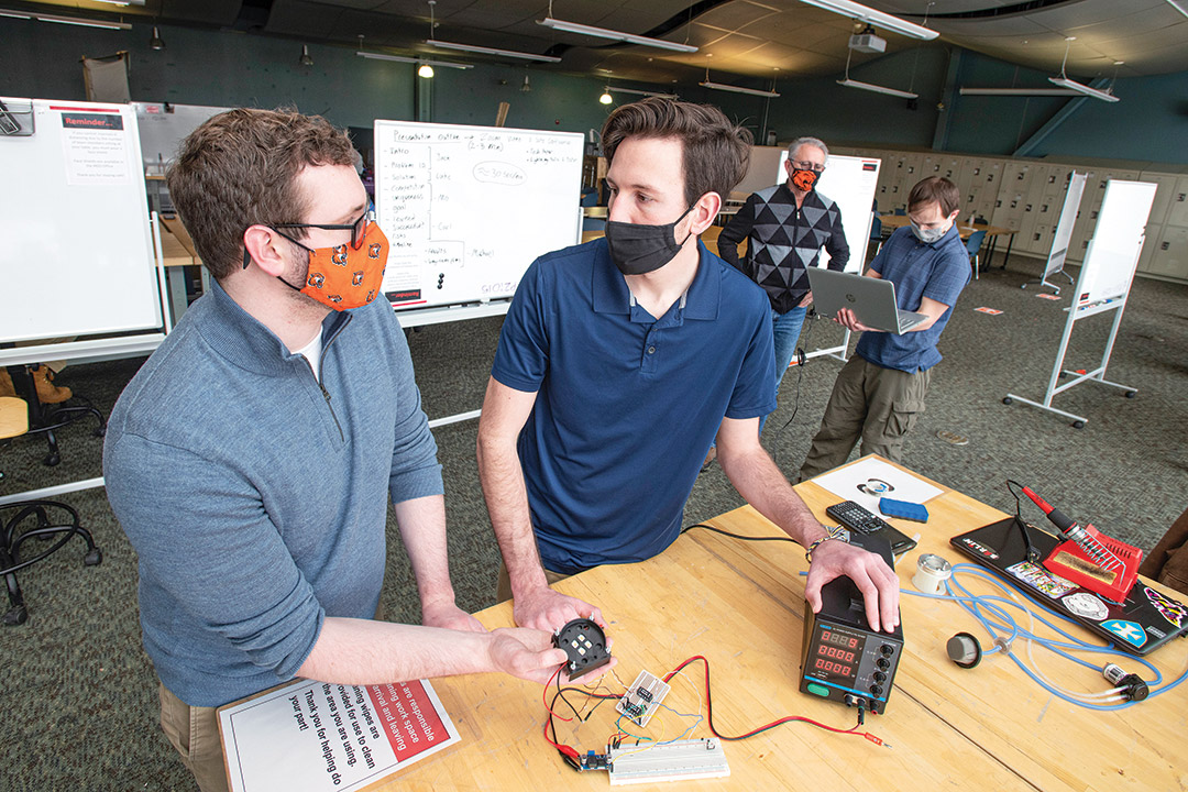 two researchers working on a water treatment technology.