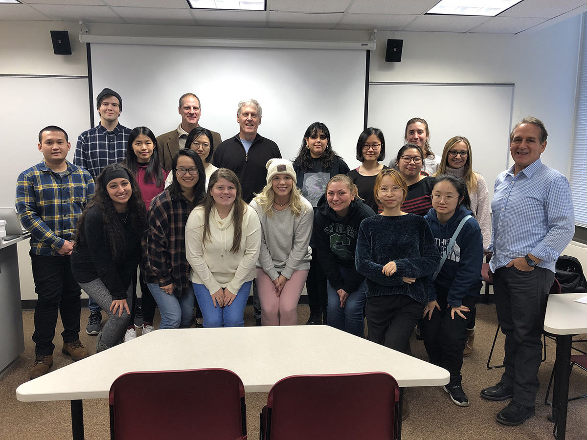 A group of RIT faculty and students pose for a group photo with Steve Sasson.