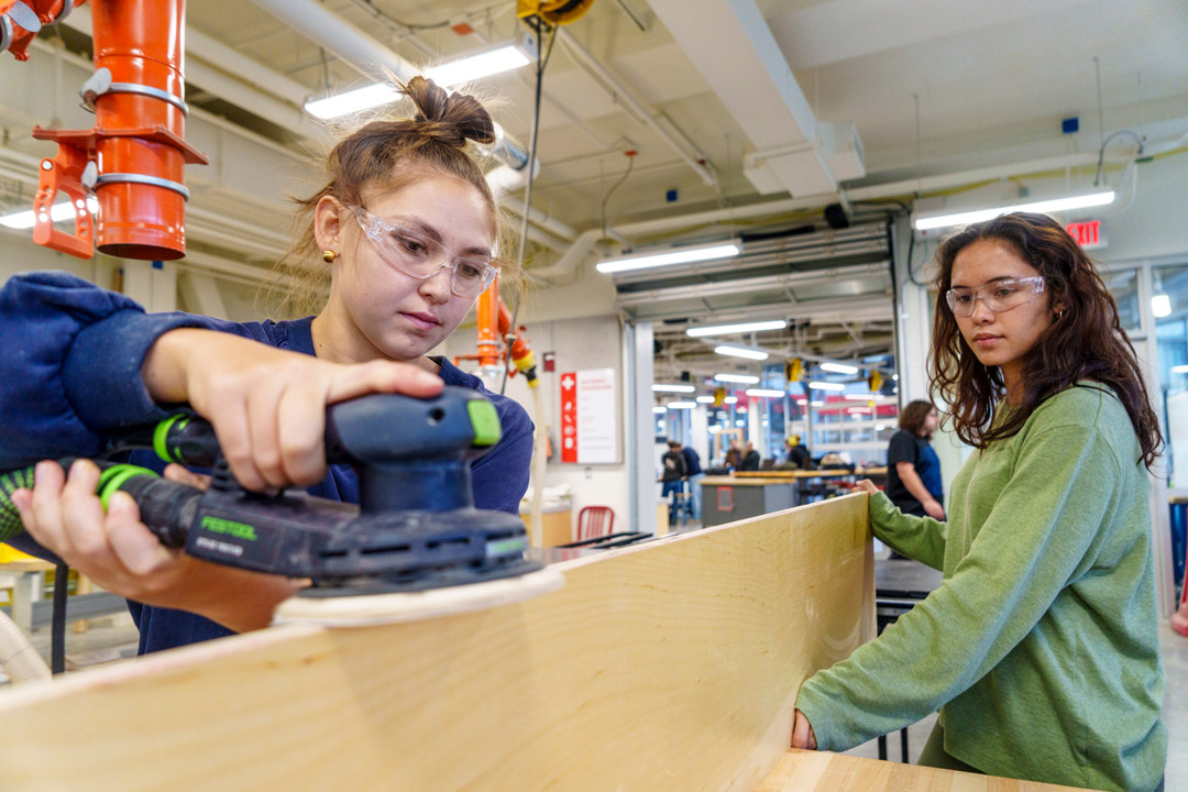 Students working in a woodshop.