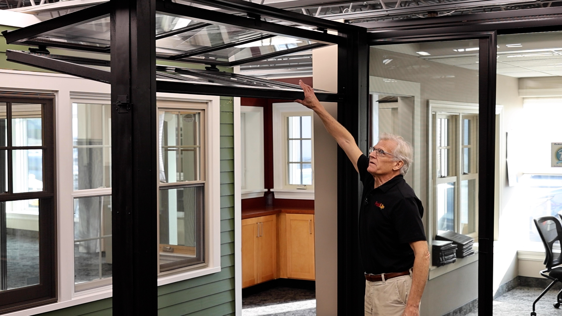 Forster demonstrates the ease of opening a FoldUp™ window in the showroom at Rochester Colonial on Lyell Avenue, Rochester, NY. 