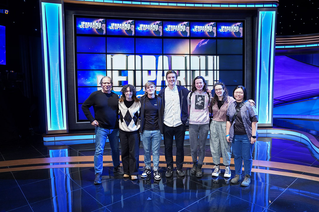 Students pose for photograph on the Jeopardy stage