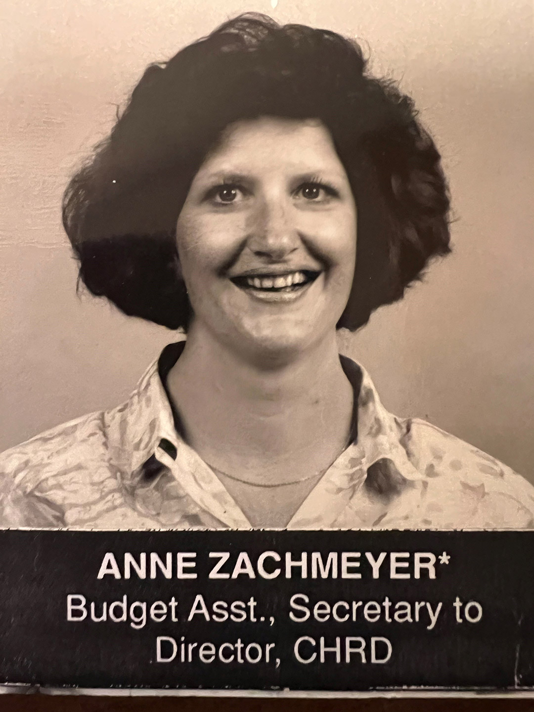 Anne Zachmeyer is shown in an amber an black colored photo from when she started at R I T.