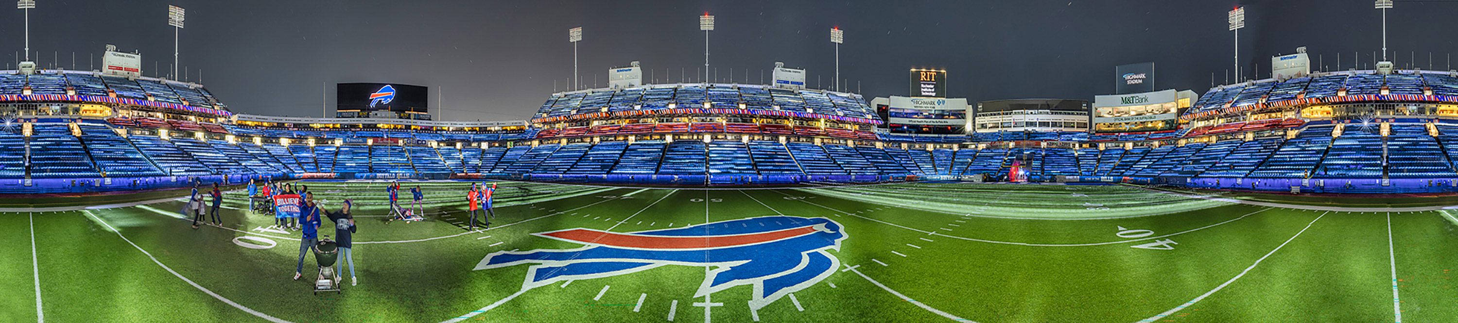 a panoramic image of Bills Highmark Stadium under the lights