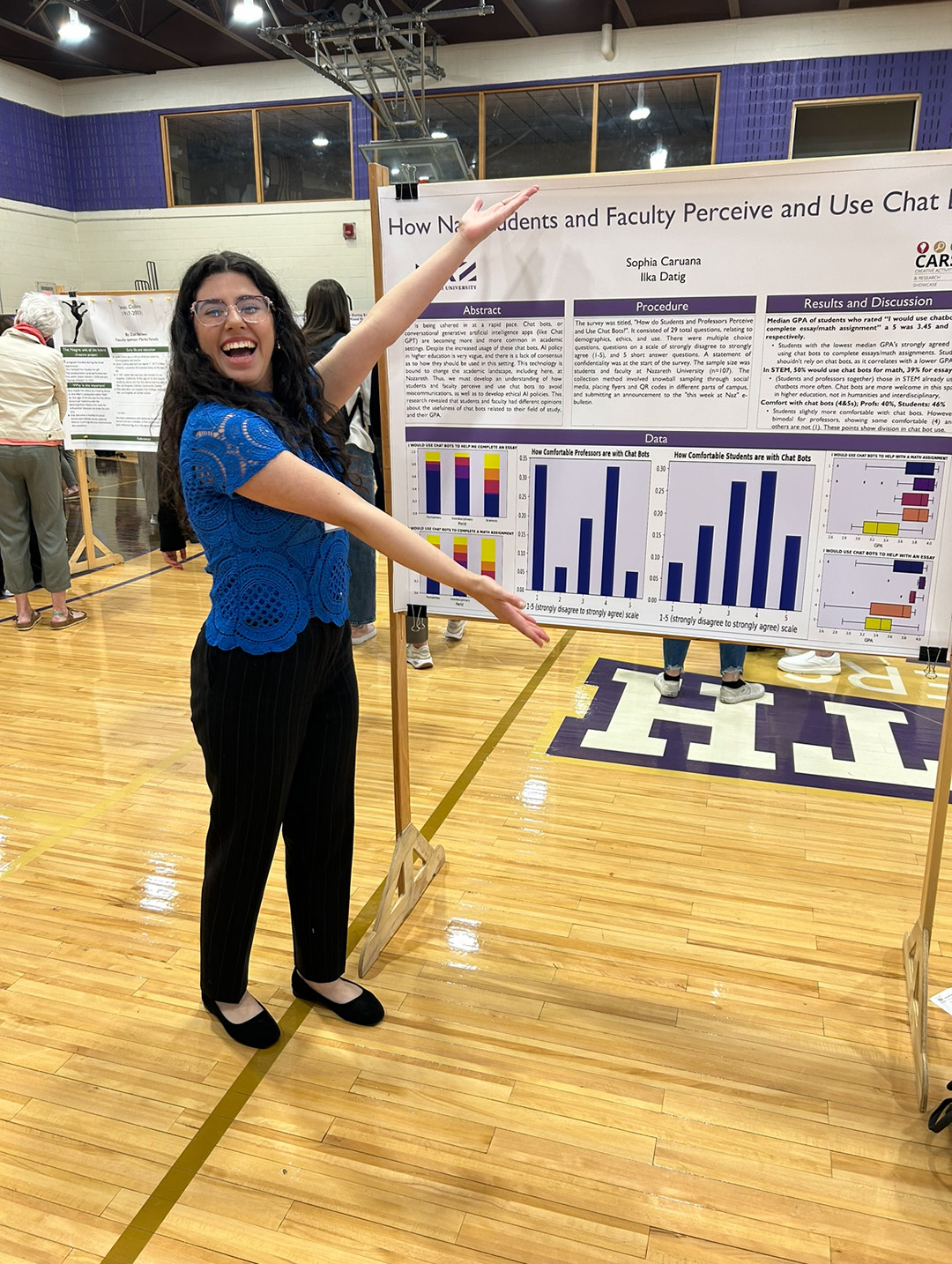 a student stands next to a whiteboard that displays a research on a project