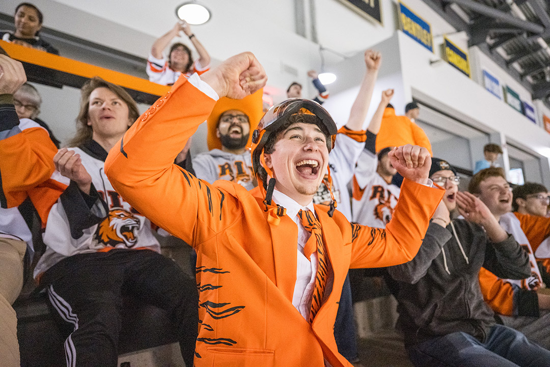 First-year student Tyler Remphrey cheers during a watch party at the Gene Polisseni Center.