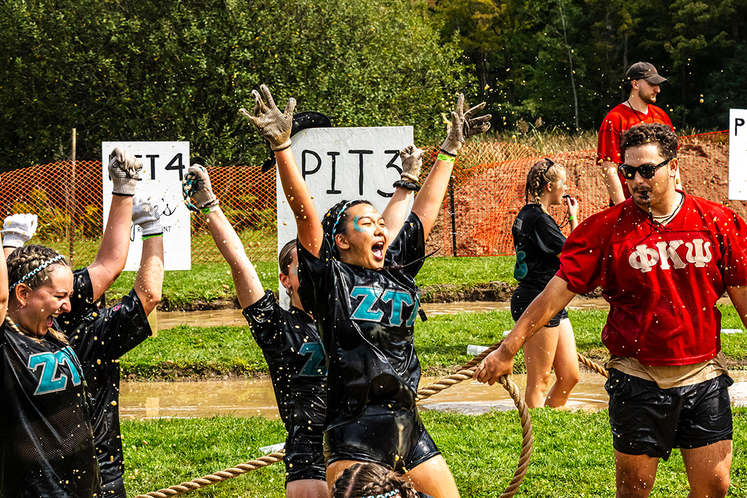 College age student participate in Mud Tug.